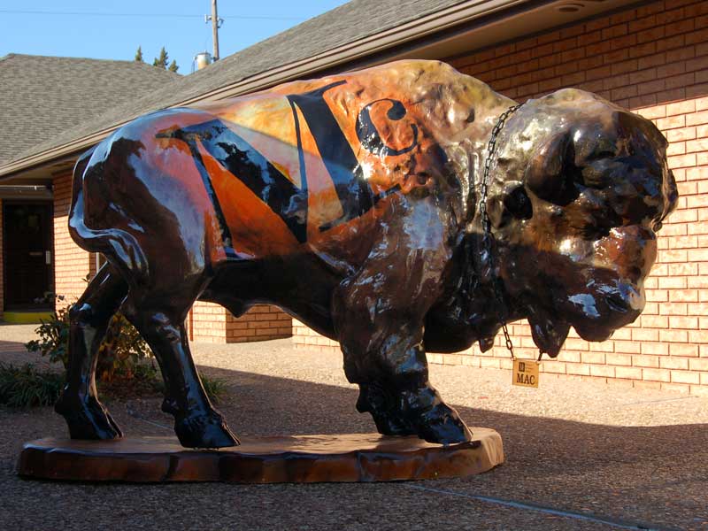 Painted buffalo sculpture with logo of McAnaw & Co. Realtors